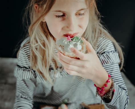 Premium Photo Midsection Of Woman Holding Ice Cream