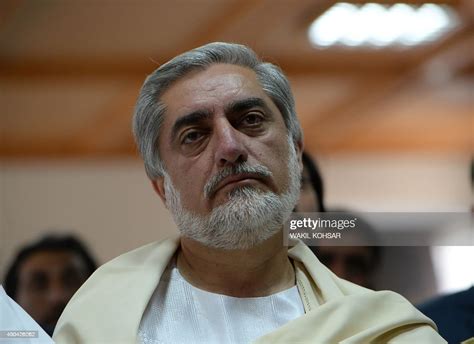 Afghan Presidential Candidate Abdullah Abdullah Looks On At A News