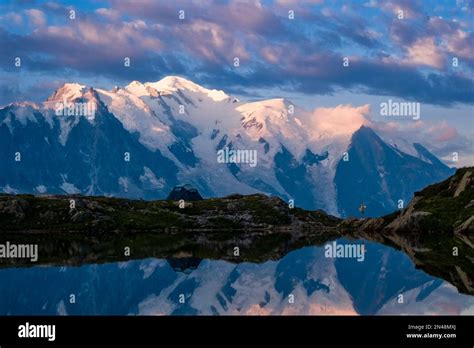 The Peaks Of The Mont Blanc Massif And Some Clouds Reflecting On The