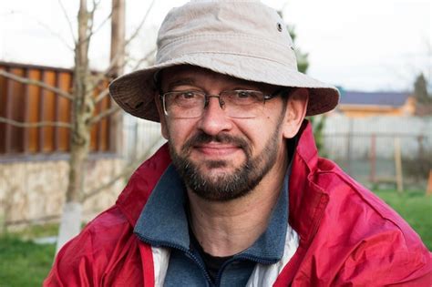 Premium Photo Smiling Bearded Man With Glasses Outdoors Portrait