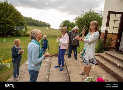 Mature Women At Book Club Meeting During Time Of Covid19 Social Distancing In Southern England