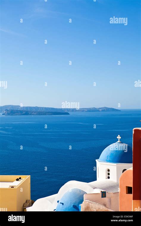 Santorini Famous Orthodox Church With Blue Domes In Village Oia Ia