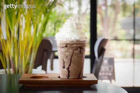 Mocha Frappuccino In Plastic Cup With Whipping Cream On Top Coffee