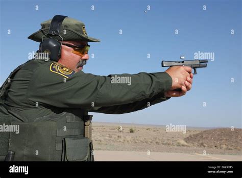 Expended Brass Flies From A Glock 47 Pistol As A Border Patrol Agent