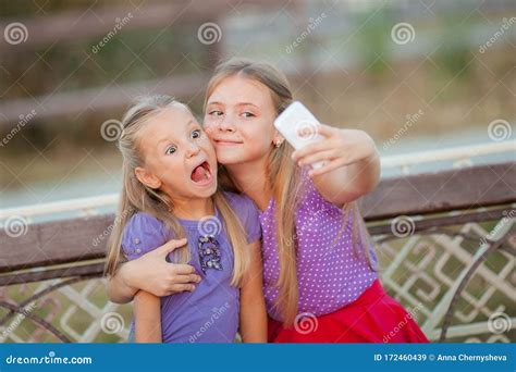 Two Joyful Girls Taking Selfie At Park Stock Image Image Of Leisure