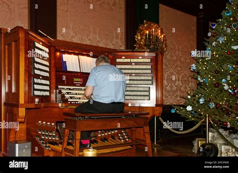 Organist Male Playing Pipe Organ Many Controls Musician Decorated