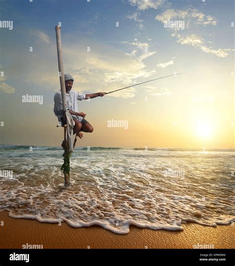 Fisherman at sunset Stock Photo - Alamy