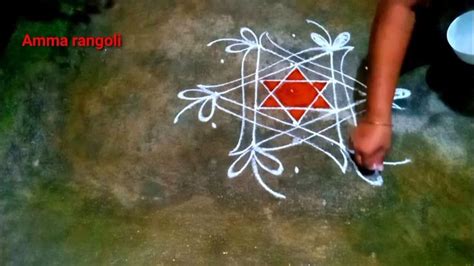 A Person Is Drawing On The Ground With White Chalk And Red Marker In