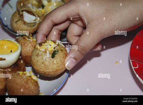 A picture of someone holding a fuska Stock Photo - Alamy