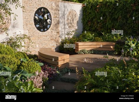 Cottage Courtyard Garden With Cotswold Dry Stone Wall And Circular