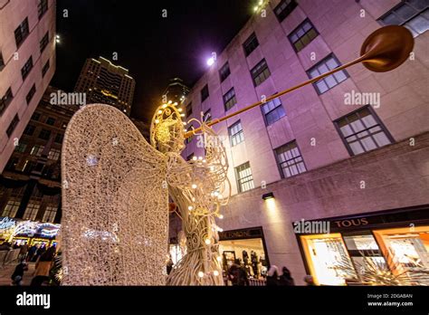 Angels Hold Up Trumpets In The Garden At Rockefeller Center Photo