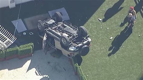 SUV falls from parking structure at hospital in Orange, lands upside down on roof of nearby ...