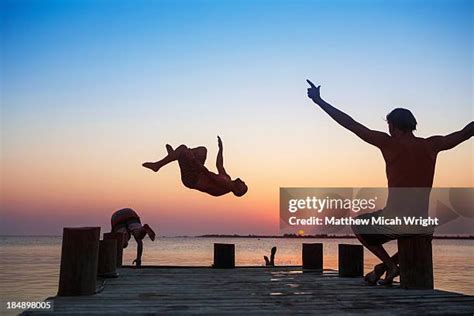 Man Diving Silhouette Photos And Premium High Res Pictures Getty Images