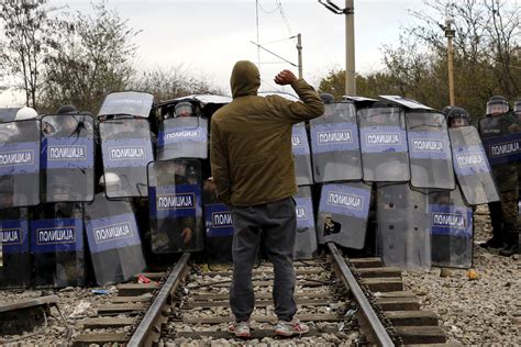 Migrants Clash With Police at Macedonia Border - Newsweek