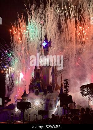 Disneyland Paris, castle with fireworks Stock Photo - Alamy