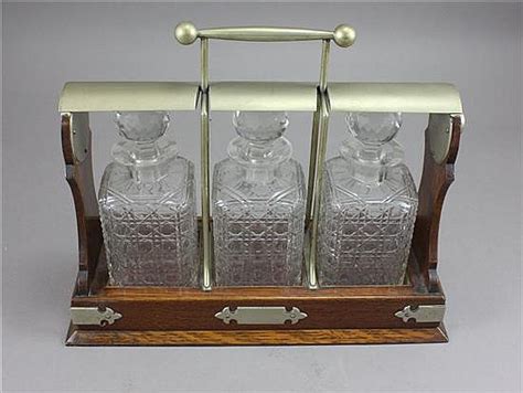 Lot Tantalus In Oak Frame With 3 Cut Glass Decanters Missing Key But Decanters Appear To Be