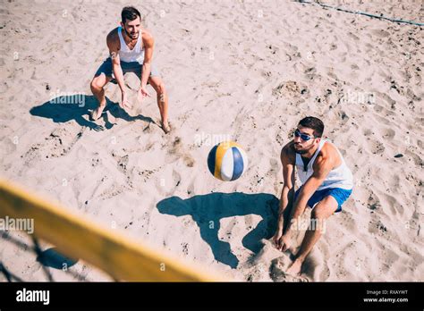 Beach volleyball game Stock Photo - Alamy