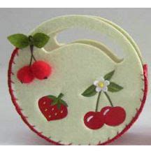 An Ornament With Cherries And Strawberries On The Front Is Made Out Of Felt