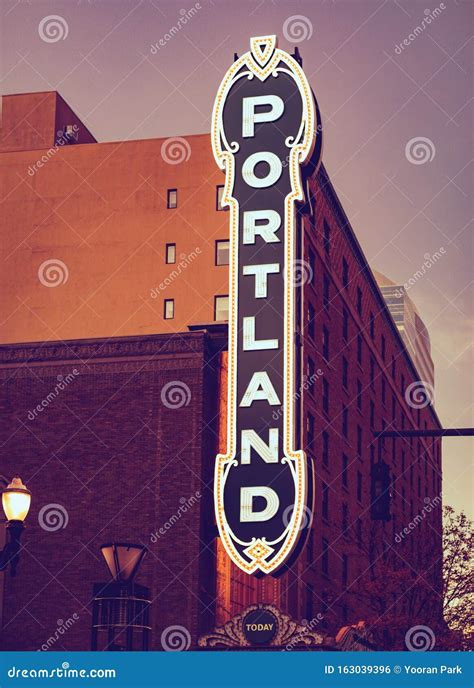 Blue Portland Sign From 30 S On Brick Building In Portland Stock Photo