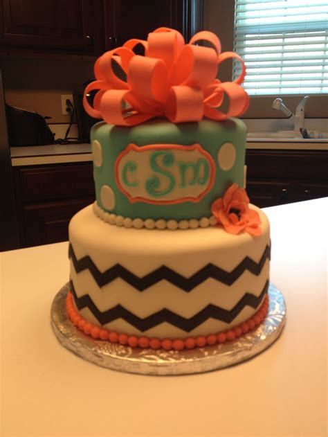 Sweet 16 Thematic Cake With Orange Bows And Monogrammed Letters