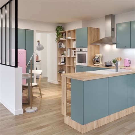 A Kitchen With Wooden Floors And Blue Cabinets In The Center Along