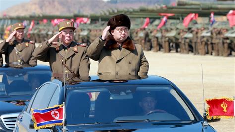 North Korean leader Kim Jong Un salutes as he arrives to inspect a ...