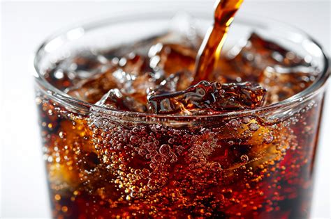 Premium Photo Pouring Cola Soda With Ice And Bubble On Front View