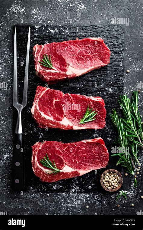 Raw Meat Beef Steak On Black Background Top View Stock Photo Alamy