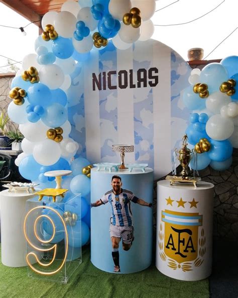 An Image Of A Man On The Field With Balloons And Decorations In Front