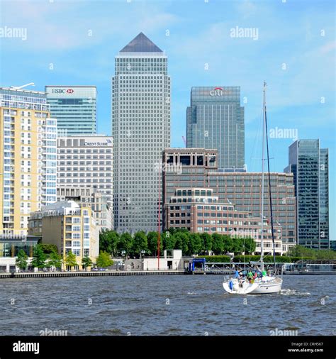 Yacht Passing The Canary Wharf Docklands Complex On A High Tide View