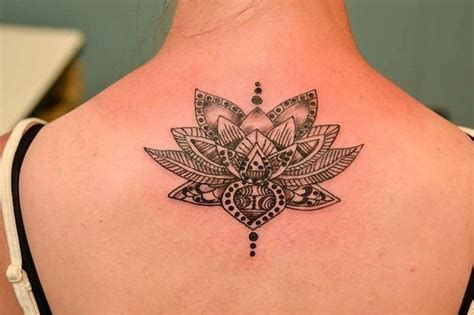 Amazing black-and-white tribal lotus flower tattoo on back ...