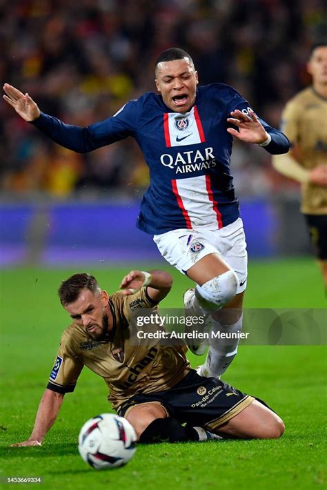 Kylian Mbappe Of Paris Saint Germain Is Tackled During The Ligue 1