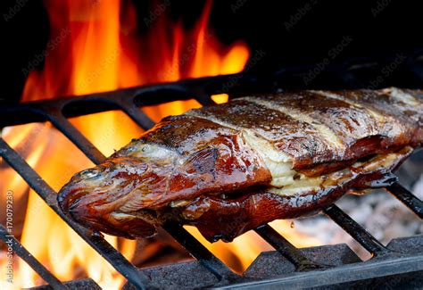 Hot Grilled fish on fire Stock Photo | Adobe Stock