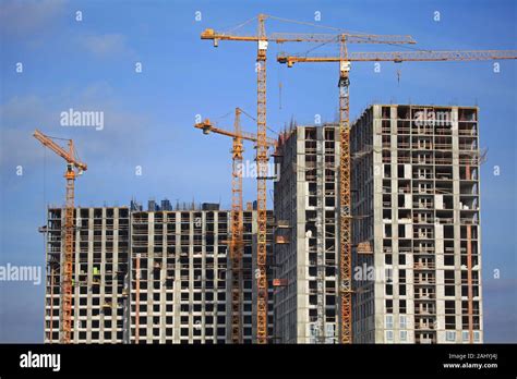 High Rise Construction Cranes And Array Of Buildings Under Construction