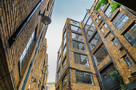 Old Dock Warehouses Converted Into Luxury Housing London Stock Photo