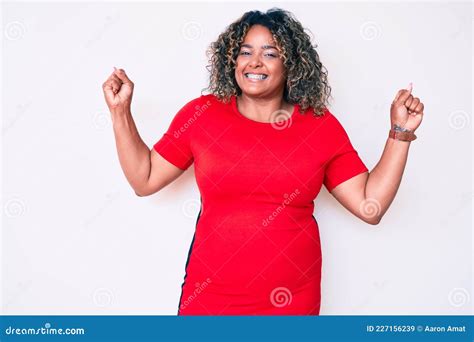 Young African American Plus Size Woman Wearing Casual Clothes Showing