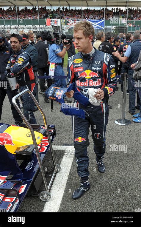 German Formula One Driver Sebastian Vettel Of Red Bull Stands In The