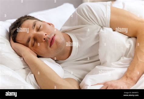 Handsome Man Sleeping In Bed Stock Photo Alamy