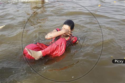 Image Of Hindu Devotees Taking Holy Bath In Triveni Sangam At Prayagraj