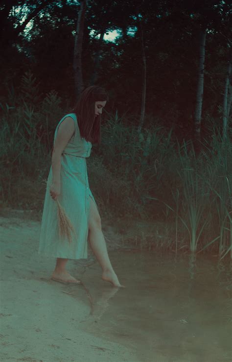 Woman in White Dress Walking Barefoot Through Forest · Free Stock Photo