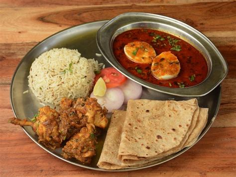 Premium Photo Chicken Thali From An Indian Cuisine Food Platter Consists Chicken Fryboiled Egg