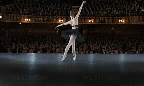 Ballerina Performing On Stage In Theater Stock Photo