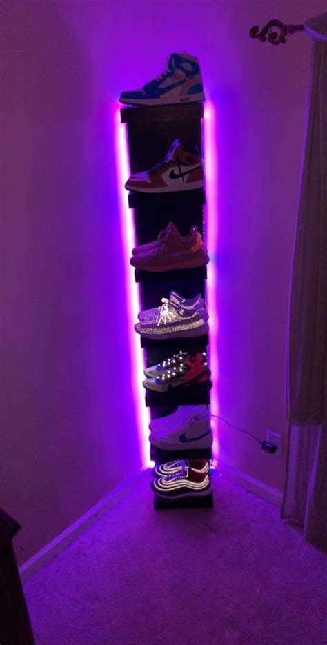 There Is A Purple Light In The Corner Of This Room And Many Shoes Are