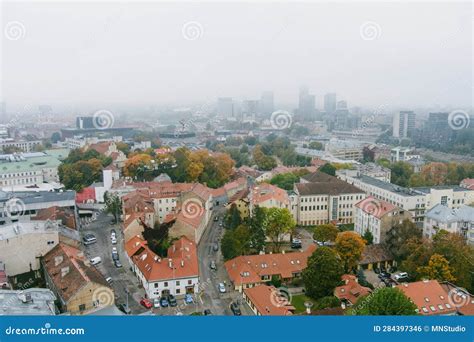 Beautiful Foggy Vilnius City Scene In Autumn With Orange And Yellow