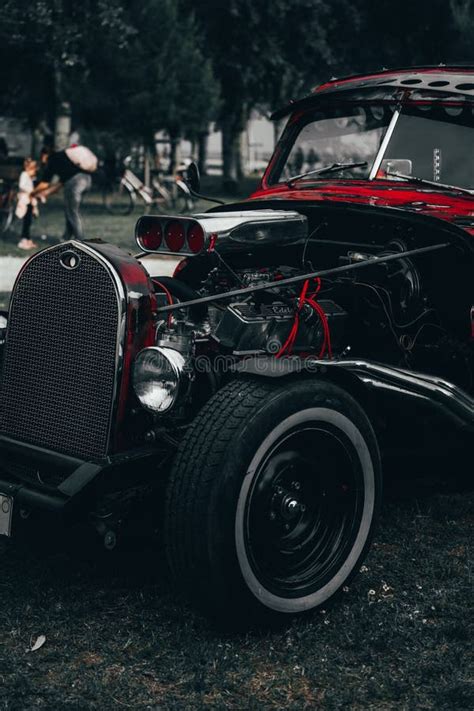 Close Up Of A Vintage Red Hot Rod Car With Exposed Engine At An Outdoor