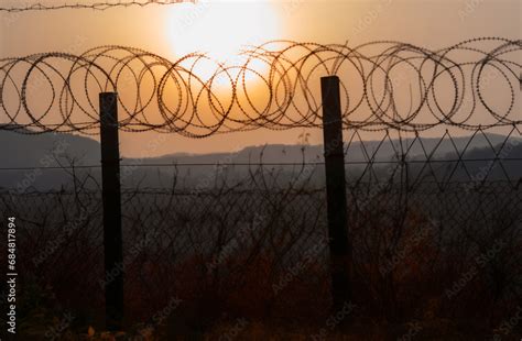 Border of South Kore and North Korea. Border with barbed wire on fence ...