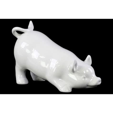 A White Ceramic Pig Figurine On A Black Background