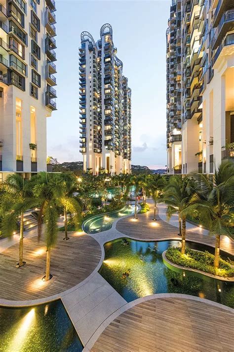 An Outdoor Swimming Pool Surrounded By Palm Trees And Other High Rise