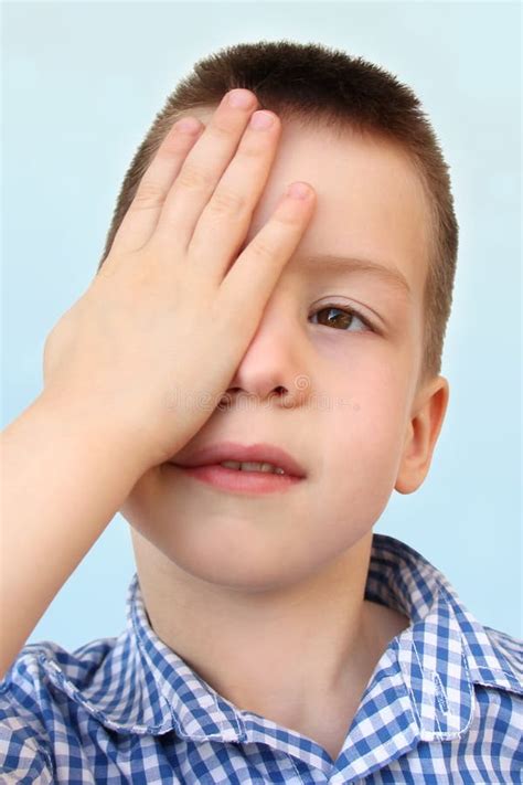 Boy Kid Part Of The Face Covered One Eye With A Palm Vision Test