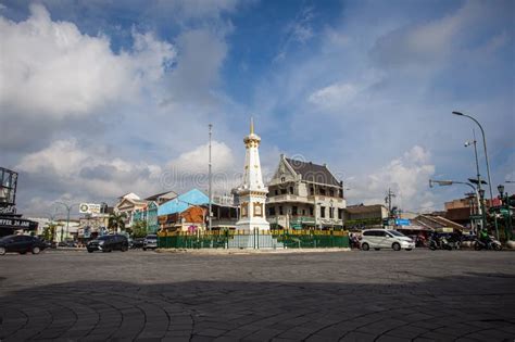 Residents And Tourists Vehicles Pass By The Tugu Monument At Jogjakarta